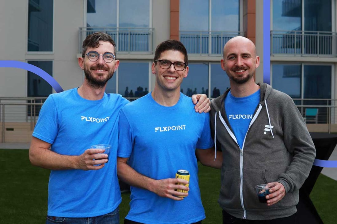 Three Flxpoint teammates in team shirts