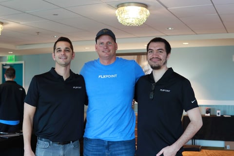 Three Flxpoint teammates indoors