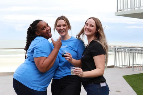 Three Flxpoint teammates smiling outside