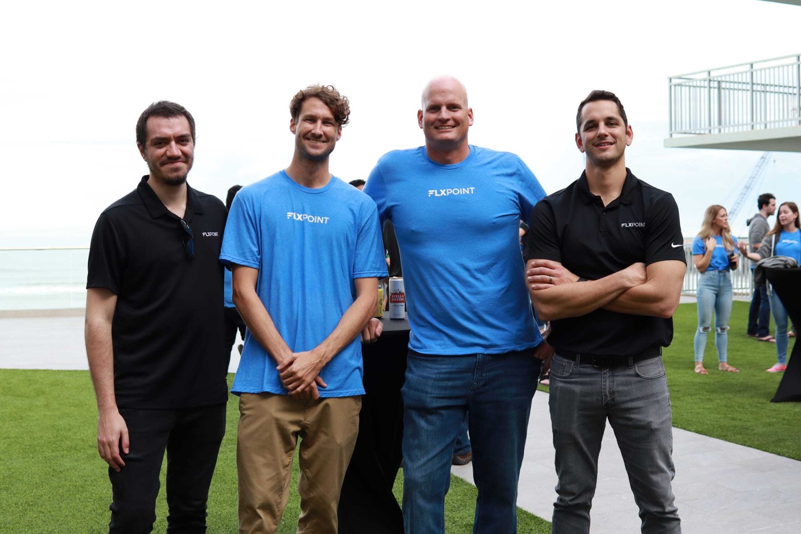 Four members of the Flxpoint integration team standing together outdoors